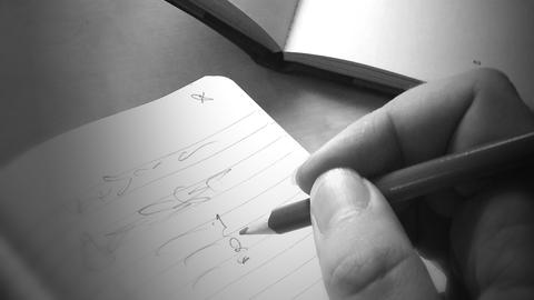Book and Writing Hand, from pxhere, public domain.
