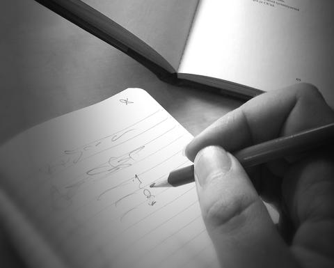 Book and Writing Hand, from pxhere, public domain.